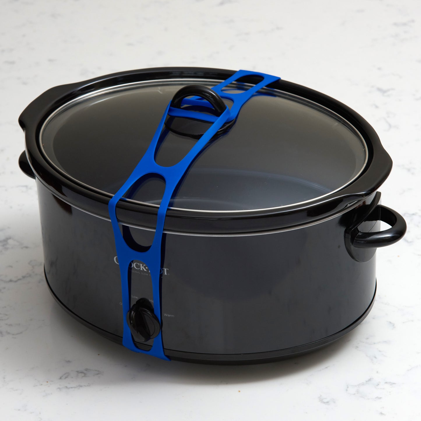 Lid Latch the reusable universal lid securing strap for crockpots, casserole dishes, pots, pans and more.