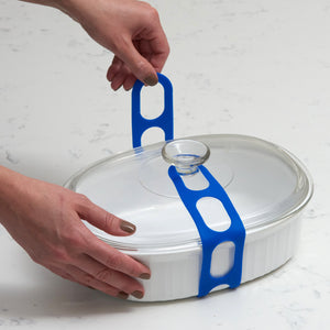 Lid Latch the reusable universal lid securing strap for crockpots, casserole dishes, pots, pans and more.